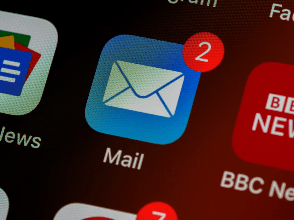 User checking email receipts and billing confirmations to verify online subscription transactions.